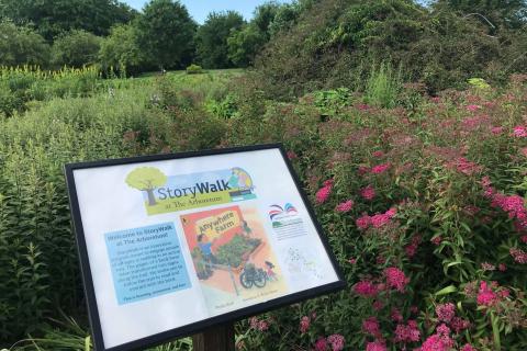 A StoryWalk board in The Arboretum